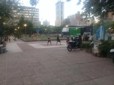 a group of people walking around in a city at Excepcional dpto frente a Plaza de la Intendencia in Cordoba