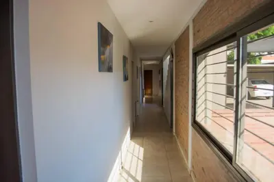 a hallway of a house with a window at Casa Decla in Villa Carlos Paz