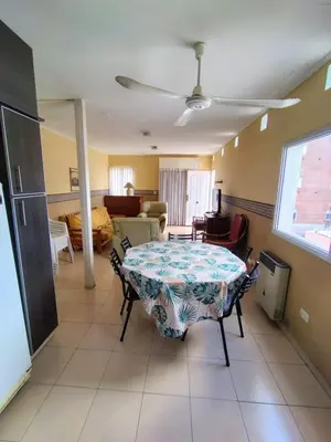 a living room with a table and a couch at Apart Hotel RITZ in Villa Carlos Paz