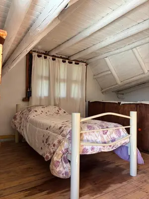 a bedroom with a bed in a attic at Indra-La Casa de Nanda in San Javier
