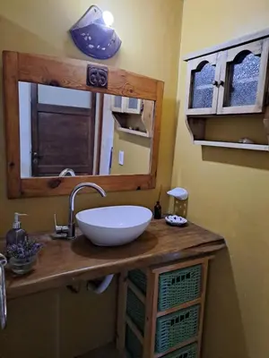 a bathroom with a sink and a mirror at Varuna- en La Casa de Nanda in San Javier