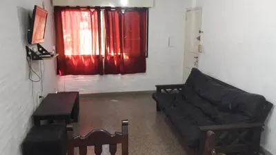 a living room with a couch and a table at Depto Tribunales in Cordoba