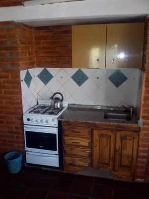 a kitchen with a stove and a sink at El Faro in Potrero de Garay