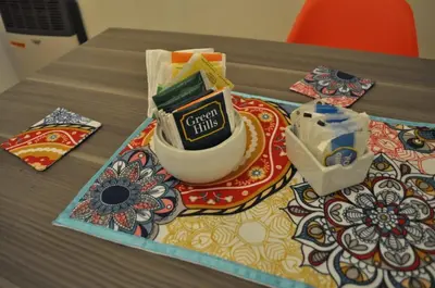 a table with a cup of coffee on a table at 37 Intendente Doctor Jaime Gil in Río Cuarto