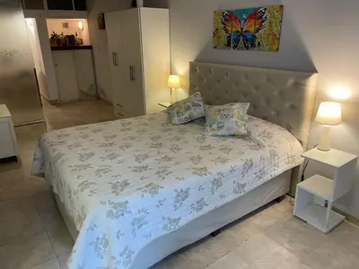 a bedroom with a large bed with two pillows at CERRO CHICO APART in Cordoba