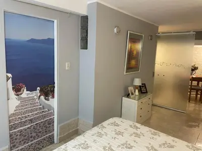 a bedroom with a view of the ocean at CERRO CHICO APART in Cordoba