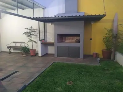 a patio of a house with a fireplace in it at Casa confortable in Cordoba