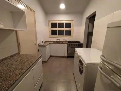 a small kitchen with a sink and a stove at Casa de Montaña in Cordoba