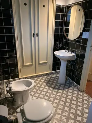 a bathroom with a toilet and a sink at Casa de Montaña in Cordoba