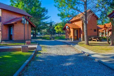 a walkway in front of a brick building at Hotel Villa Sol in Merlo