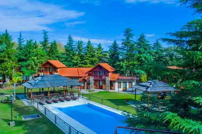 an aerial view of a house with a swimming pool at Hotel Villa Sol in Merlo