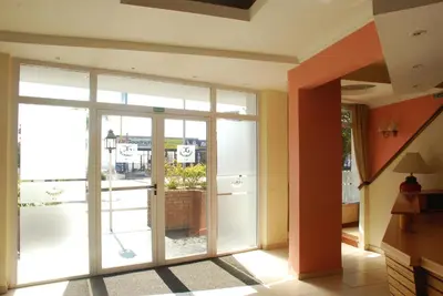 a room with a sliding glass door in a building at Hotel Gran Crisol in Cordoba