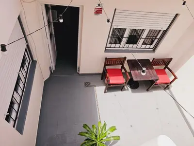 an overhead view of a balcony with a table and chairs at LitStay Paso de los Andes PB in Cordoba