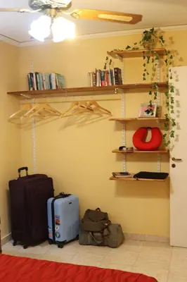 a room with luggage and shelves on the wall at Casa Alberdi in Cordoba