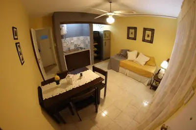 a living room with a bed and a television in a room at Casa Alberdi in Cordoba