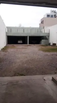 an empty parking lot with a building in the background at Apartamentos Santa Rosa PB 1 in Cordoba