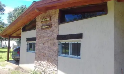 a house with a brick and wood roof at El Amanecer in Santa Rosa de Calamuchita