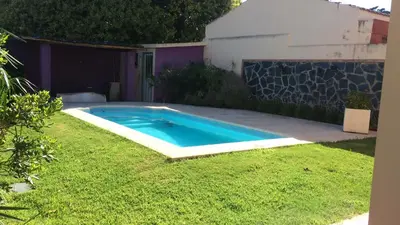a swimming pool in the yard of a house at Departamento Carlos paz in Villa Carlos Paz