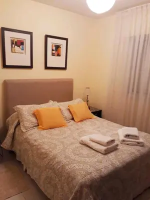 a bedroom with a bed with two towels on it at Tranquilo, comodo y cerca de todo in Cordoba