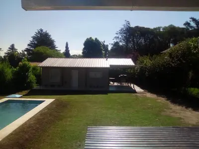 a house with a swimming pool in a yard at Tu Casa en Villa General Belgrano Calamuchita Córdoba in Villa General Belgrano