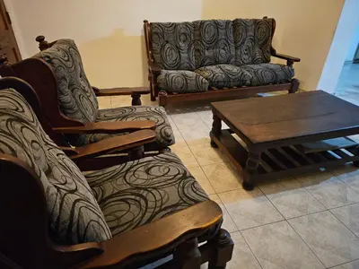a living room with a couch and a coffee table at Mi casa, equipada para el viajero y su familia in Cordoba