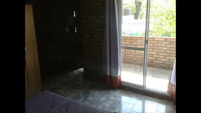 an empty room with a door and a window at Santa isabel in Embalse