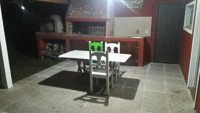 a table and two chairs in a kitchen at El Reencuentro in Los Reartes