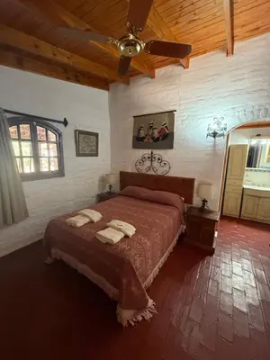 a bedroom with a bed and a ceiling at La Posta del Mistol in Las Tapias