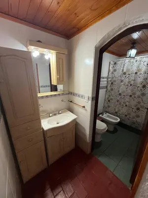 a bathroom with a sink and a toilet at La Posta del Mistol in Las Tapias