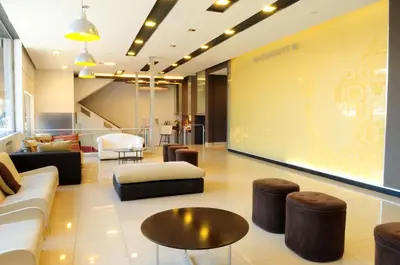 a living room with a couch and a table at Hotel Presidente in Villa Carlos Paz