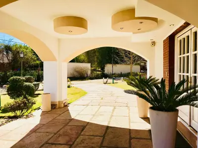 an archway in a house with a potted plant at Posada del Tiempo in Merlo