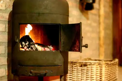 a brick oven with a fire inside of it at Al Encuentro Casas de Montaña in Nono