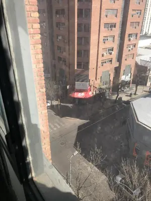 a view from a window of a building with a truck at apart Italia in Río Cuarto
