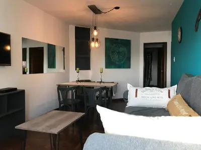 a living room with a couch and a table at apart Italia in Río Cuarto