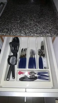 a drawer filled with utensils on top of a counter at Apartamentos Santa Rosa 2 B T1 in Cordoba