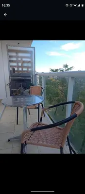 a table and chairs on a balcony with a view at Apartamentos Santa Rosa 2 B T1 in Cordoba