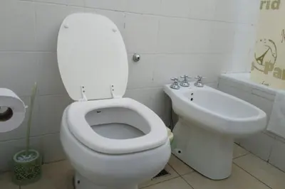 a bathroom with a white toilet and a sink at Apartamentos Santa Rosa 2 B T1 in Cordoba
