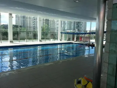 a large swimming pool in a large building at alto villa sol in Cordoba