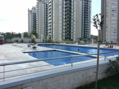 a swimming pool in a city with tall buildings at alto villa sol in Cordoba