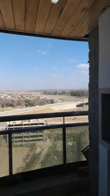 a large window in a building with a view of a field at alto villa sol in Cordoba