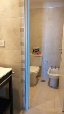 a bathroom with a toilet and a sink at alto villa sol in Cordoba