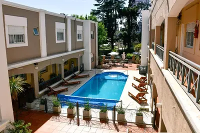 a view of a pool from the balcony of a building at Solares Hotel & Spa in Alta Gracia