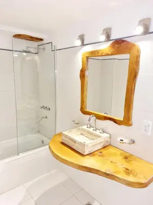 a bathroom with a sink and a mirror at Hotel La Cumbrecita in La Cumbrecita