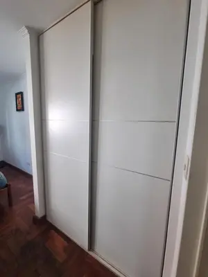 a pair of sliding glass doors in a room at Edificio Pampa - Departamento Nueva Córdoba in Cordoba