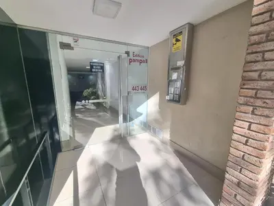 a hallway with a glass door in a building at Edificio Pampa - Departamento Nueva Córdoba in Cordoba