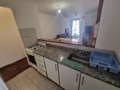 a kitchen with a sink and a counter top at Edificio Pampa - Departamento Nueva Córdoba in Cordoba