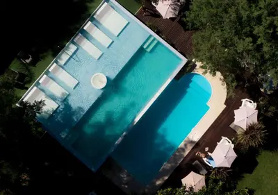 an overhead view of a swimming pool at Windmuhle Apart Hotel & Spa in Villa General Belgrano