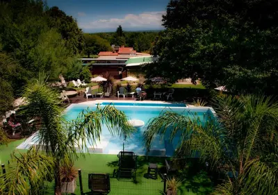 an overhead view of a swimming pool in a resort at Windmuhle Apart Hotel & Spa in Villa General Belgrano