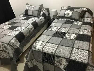 two beds sitting next to each other in a bedroom at Alonso 540 Departamento in Río Cuarto