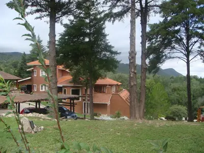 a house in the woods with a view at Chalet Suisse Posada & SPA - Adults only in Villa General Belgrano